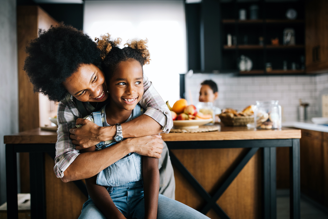 mother and child having fun preparing healthy food